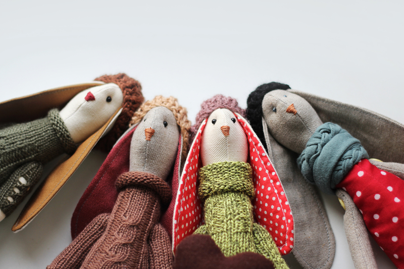 The image features five handcrafted fabric dolls...
<br/>
<a class=